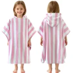 Front and back view of a little girl wearing a pink and white vertical striped hooded beach towel poncho