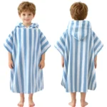 Front and back view of a boy wearing a light blue and white vertical striped hooded beach towel poncho.