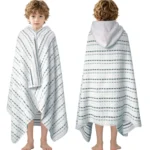 Front and back view of a boy wearing a white and green striped wearable hooded cotton towel poncho