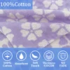Close-up of the soft 100% cotton aqua purple striped fabric of the kids poncho towel