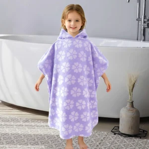 Back view of a child wearing an aqua purple striped hooded cotton poncho towel