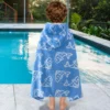 Blue Fish Pool Towel Toddler wearing a blue fish print towel beside a swimming pool