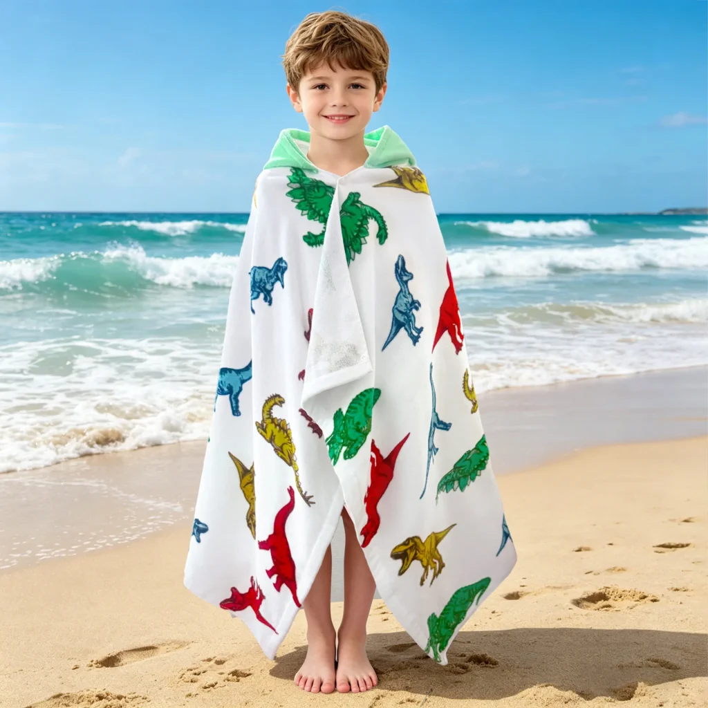 Front and back view of colorful dinosaur kids hooded poncho towel for boys and girls