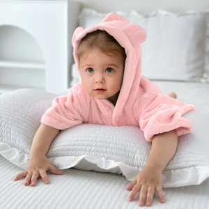 Pink Baby Hooded Bathrobe Lifestyle Baby wearing a soft pink hooded bathrobe