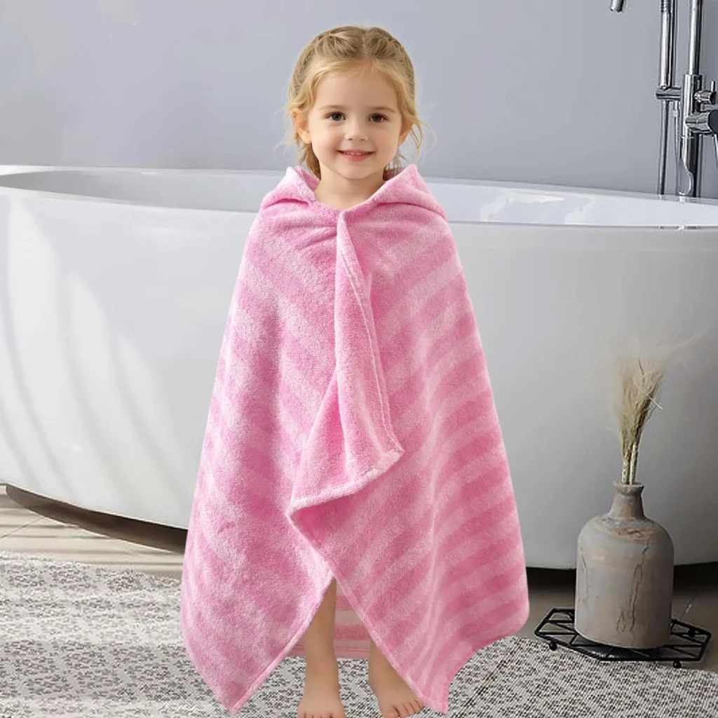Child wearing a pink striped wearable hooded towel, front and back view