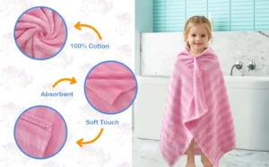 Child wearing a pink striped hooded towel after bath